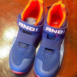 Never worn, brand new high top red and blue lace up sneaker by AND1.